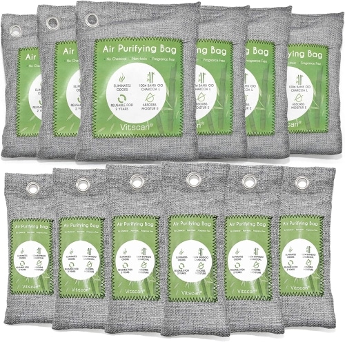 A bunch of green and grey Bamboo Charcoal Air Purifying Bags in a row.