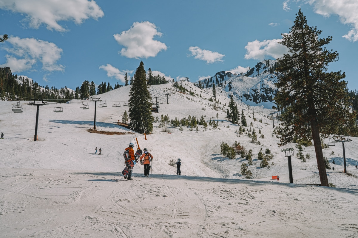 Snowboarders at Palisades Tahoe.