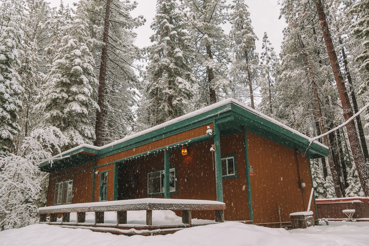 Wooden building in Lake Tahoe with snow coming down.