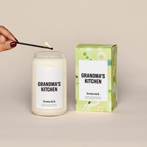 Homesick premium scented candle with label reading "grandma's kitchen."