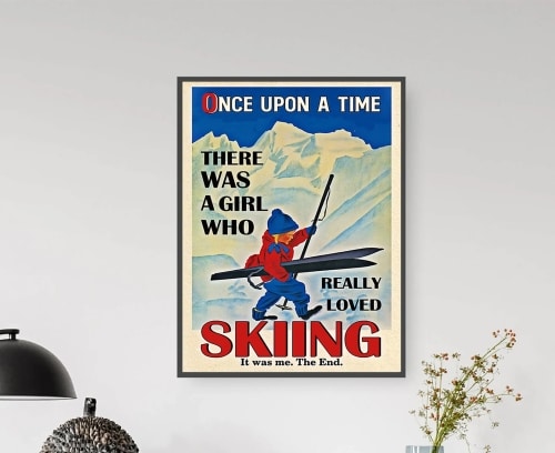 Retro ski poster that says "Once Upon a time there was a girl who really loved skiing" with a cartoon picture of a girl holding skis and ski poles with white mountains behind her.