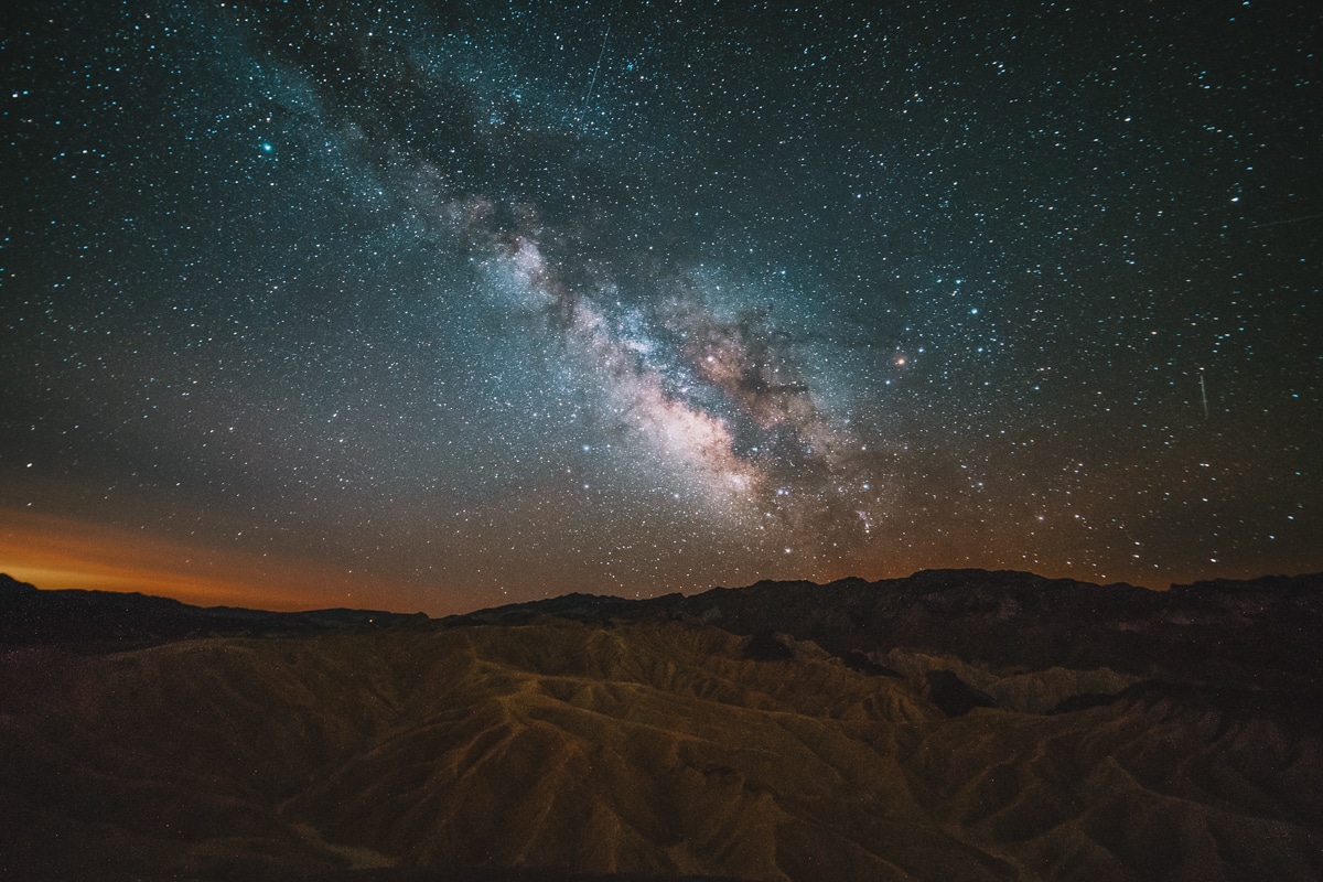 Night sky with a visible milky way over Zabriskie point.