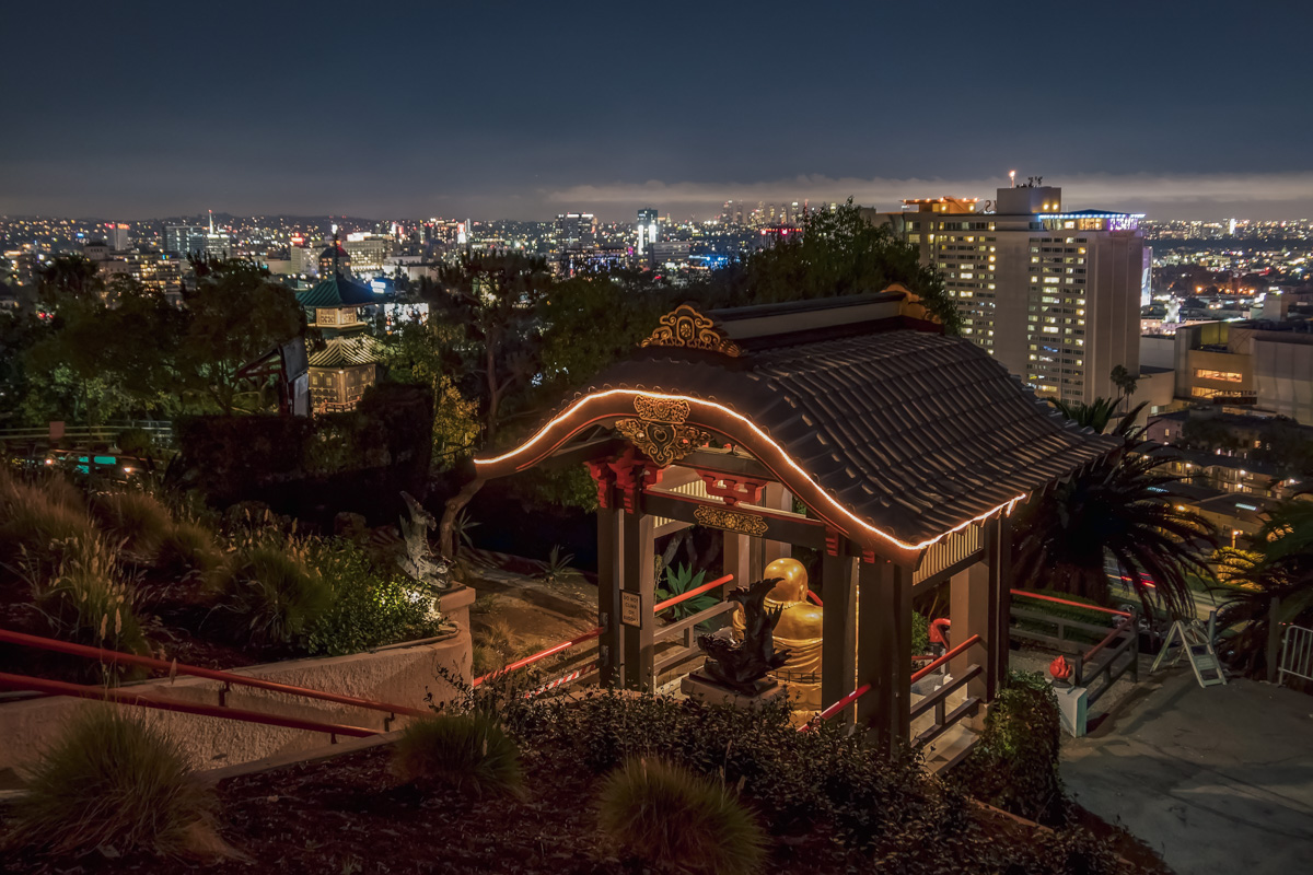 View of LA at night from Yamashiro Hollywood restaurant, taken with the Buddha in the foreground.