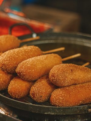 A bunch of Korean corn dogs in the San Francisco Bay Area that are ready to eat.